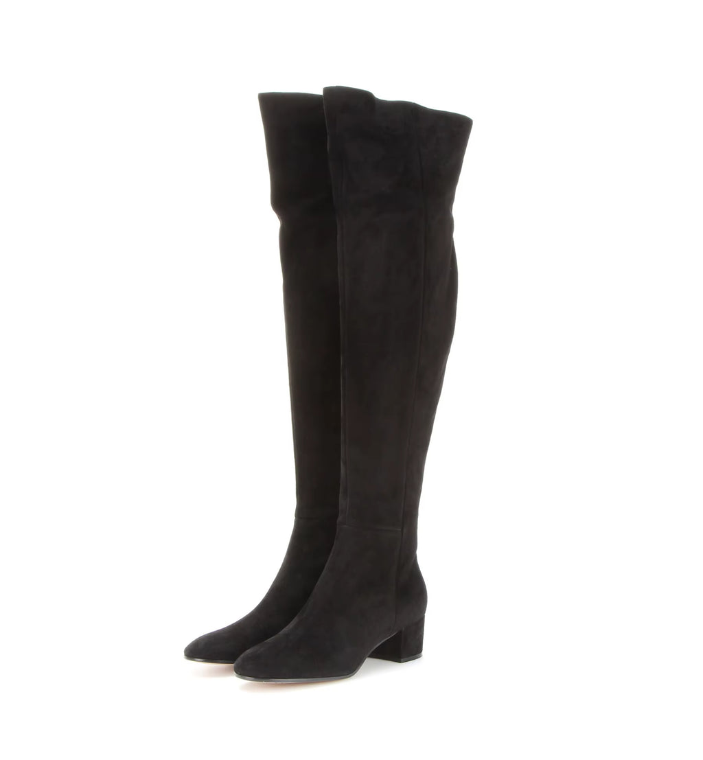 Black knee-high boots on a white background