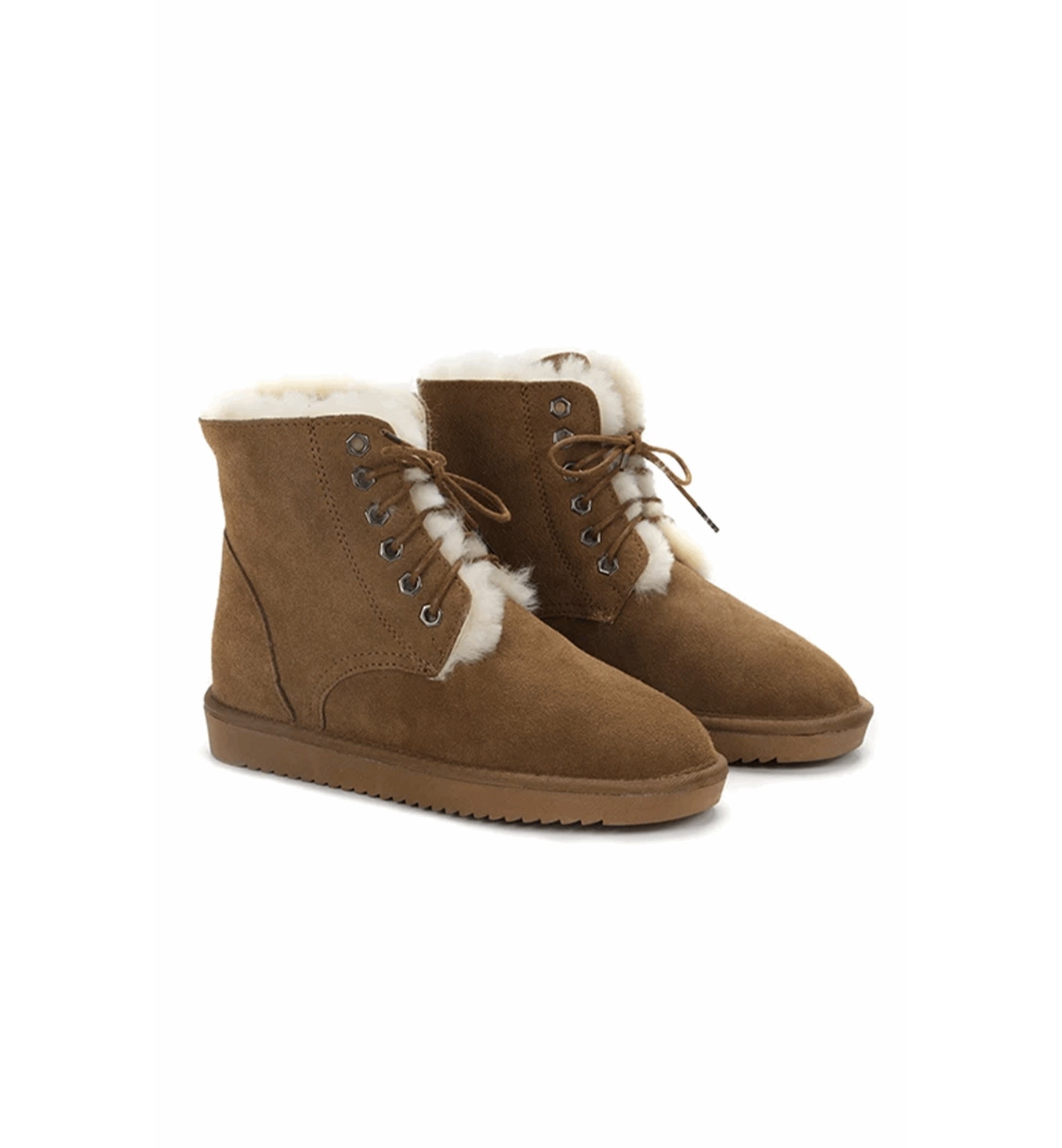 Pair of brown suede boots with white fur lining on a white background