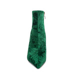 Green velvet boot on a white background