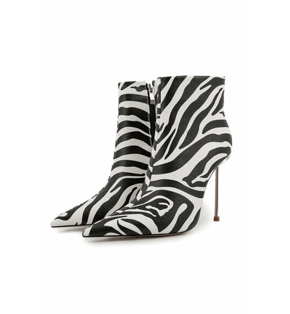 Zebra patterned high-heeled boots on a white background