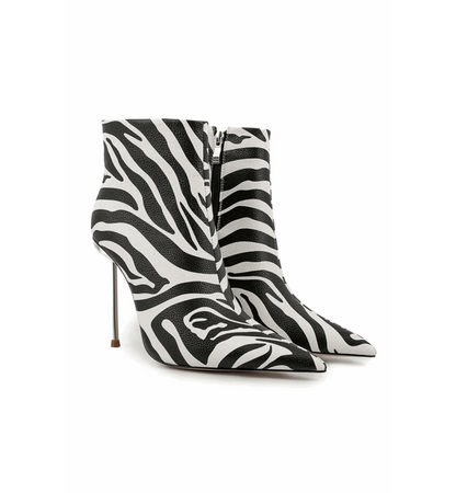Zebra print high-heeled boots on a white background