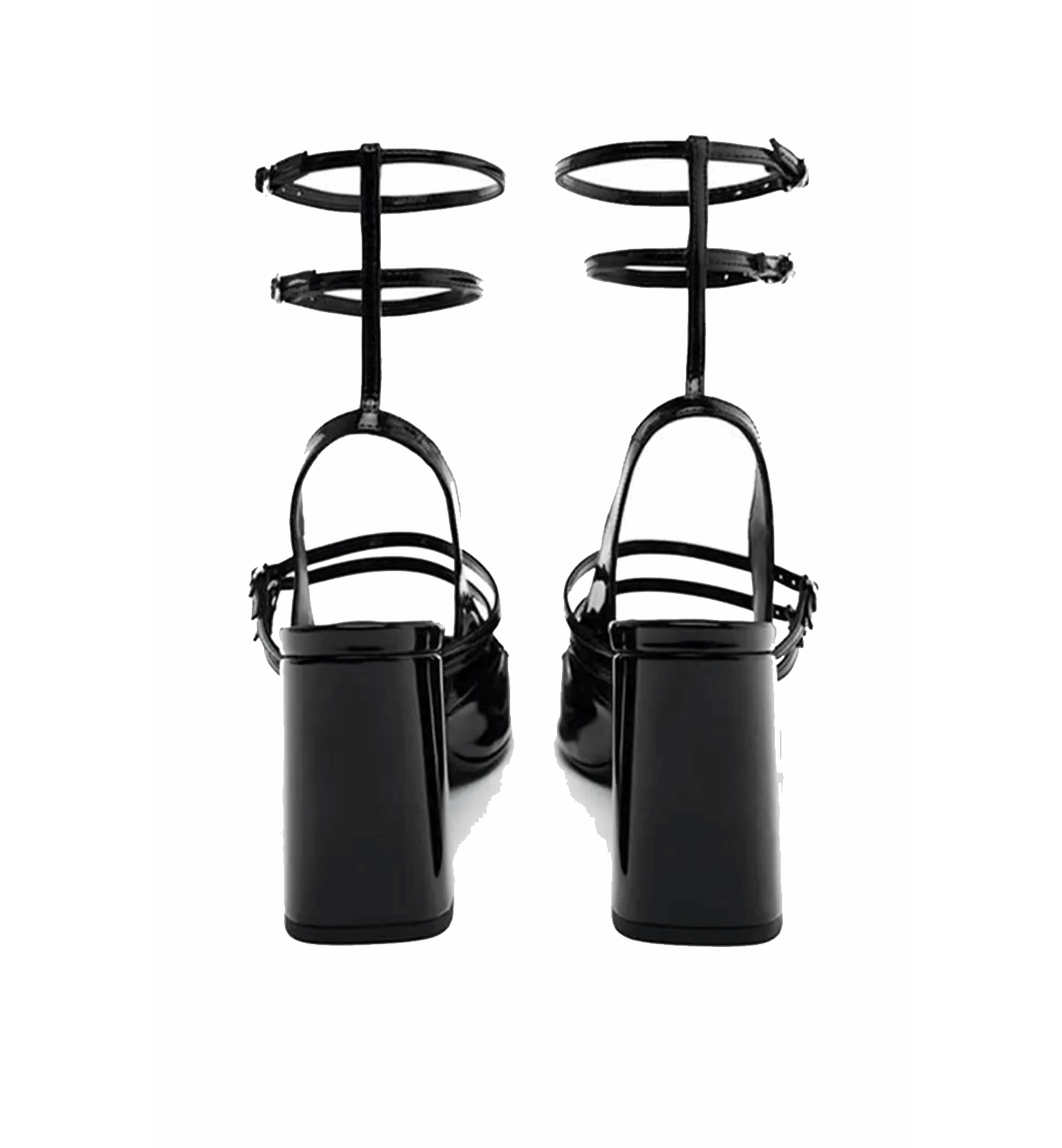Black high-heeled shoes with unique strap design on a white background