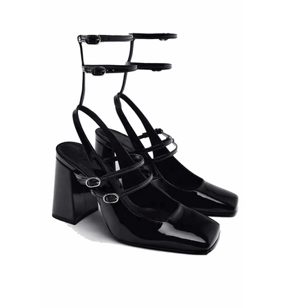 Black high-heeled shoes with multiple straps on a white background