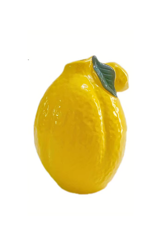 Bright yellow ceramic vase designed in the shape of a lemon