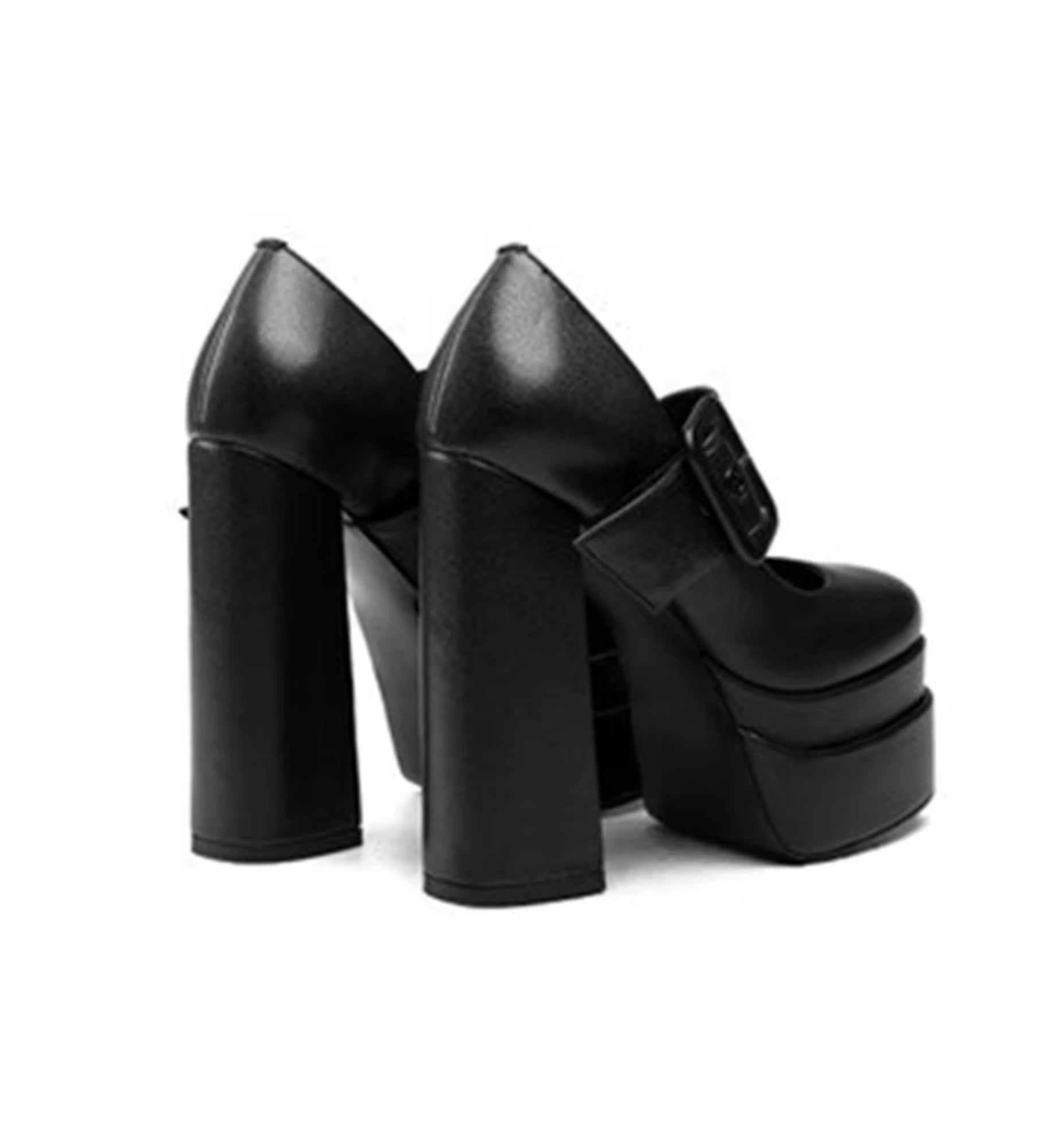 Black platform shoes on a white background