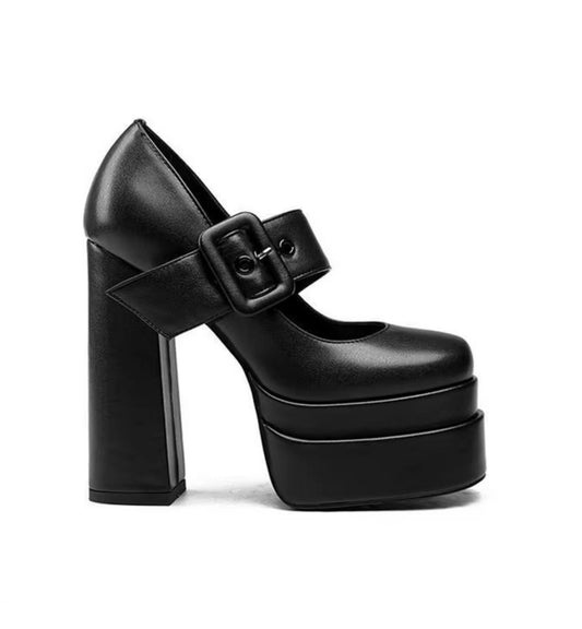 Black platform high heel shoe with a buckle on a white background