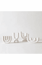 White ceramic candlestick holder