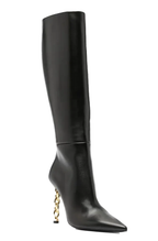 Black knee length boots with chain heels