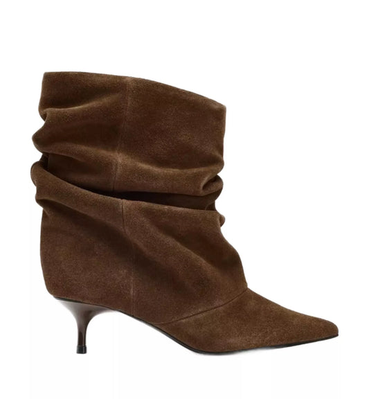 Brown suede ankle boot with a pointed toe and thin heel on a white background